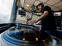 Reggae DJ, Ed Slota, spins a song over the airways for the final time, before WUMD goes online only.  The University of Massachusetts Dartmouth radio station, WUMD, stopped broadcasting over the airwaves after 42 continuous years.   It will now continue to broadcast strictly over the internet at www.umd.rocks   [ PETER PEREIRA/THE STANDARD-TIMES/SCMG ]